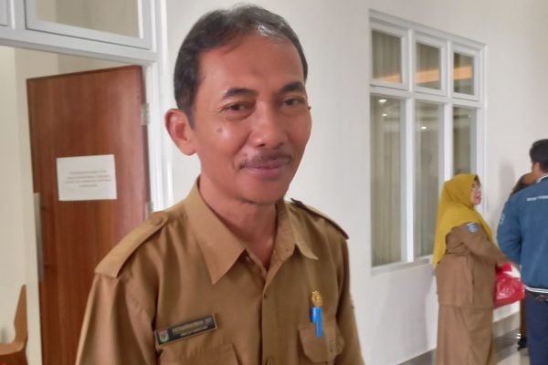 Kepala Dinas Sosial dan Pemberdayaan Perempuan dan Perlindungan Anak (P3A) Lombok Utara, Fathurrahman. (Foto kicknews.today/Anggi)